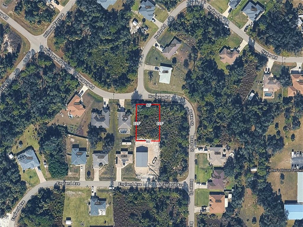 An aerial map view shows a rectangular vacant lot outlined in red between residential streets — HUNGARY ROAD, NORTH PORT, FL