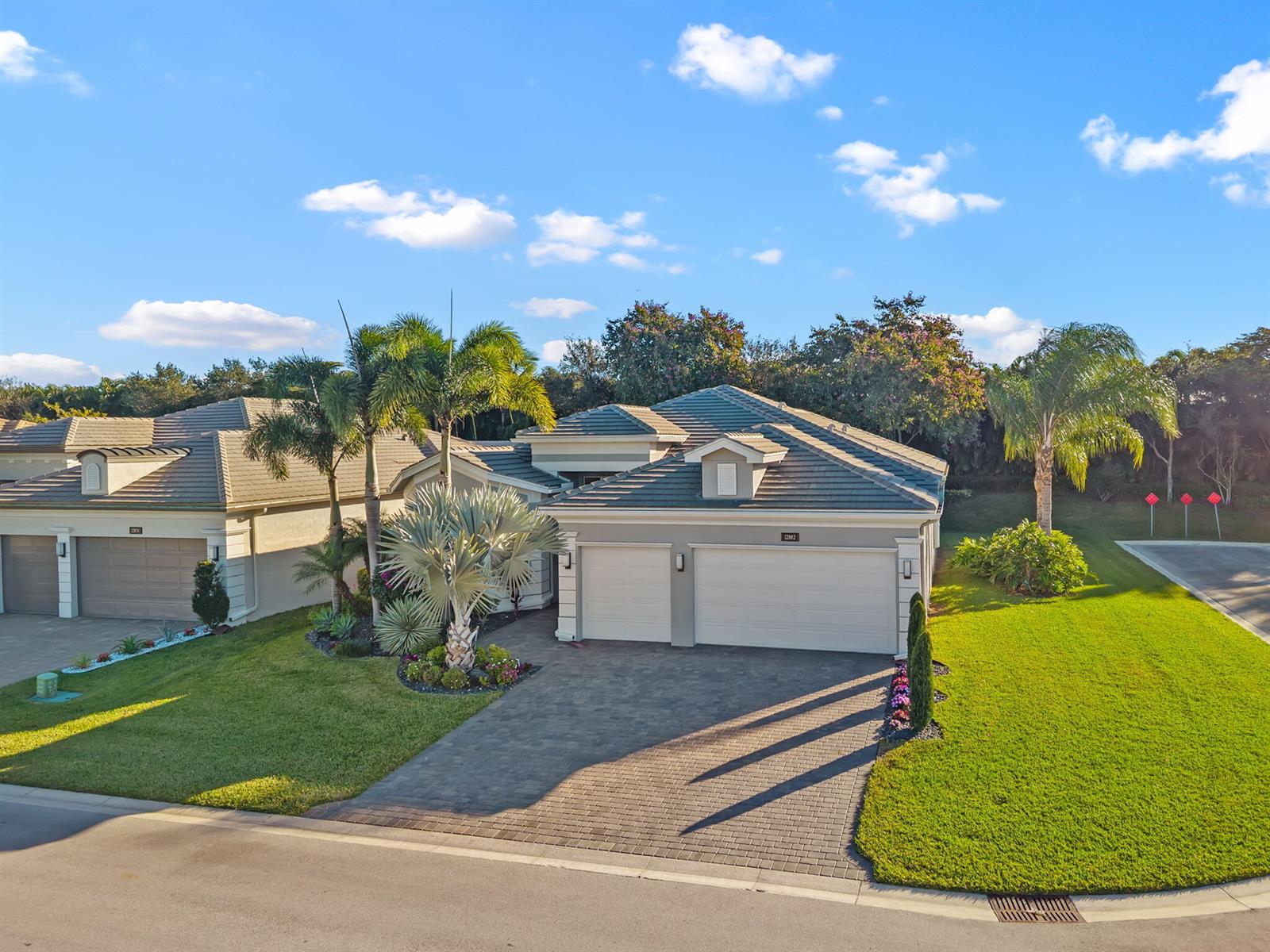 An aerial view of a suburban house with a paved driveway and a tile roof — 12882 Granite Mountain Pass, Boynton Beach FL 33437, BOYNTON BEACH, FL
