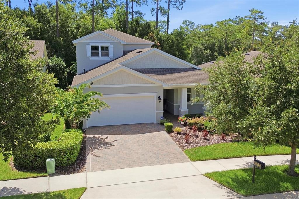 An aerial view of a two-story suburban house with a paved driveway and landscaped yard — 918 S VICTORIA HILLS DRIVE, DELAND, FL