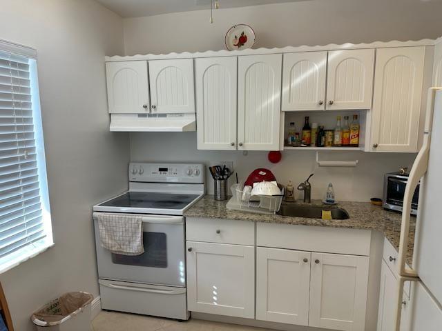 A kitchen with white cabinets, granite countertops, and white appliances — 600 NW 77th Avenue # 208, Margate FL 33063, MARGATE, FL