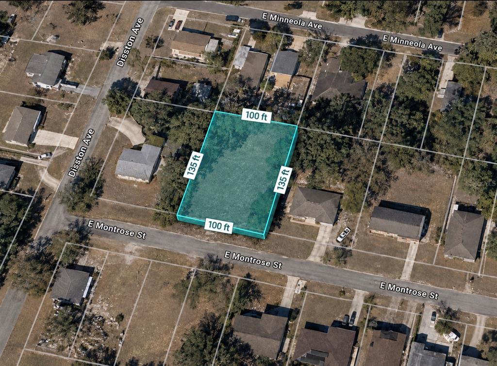 An aerial view shows a rectangular vacant lot highlighted in blue with dimensions 100 by 135 — 526 E MONTROSE STREET, CLERMONT, FL