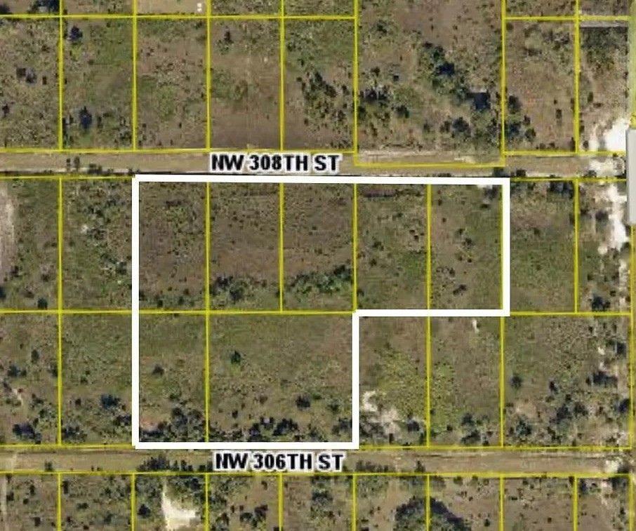 An aerial map shows a white outline highlighting several adjacent land parcels between two streets — 17065 NW 306th Street, Okeechobee FL 34972, OKEECHOBEE, FL