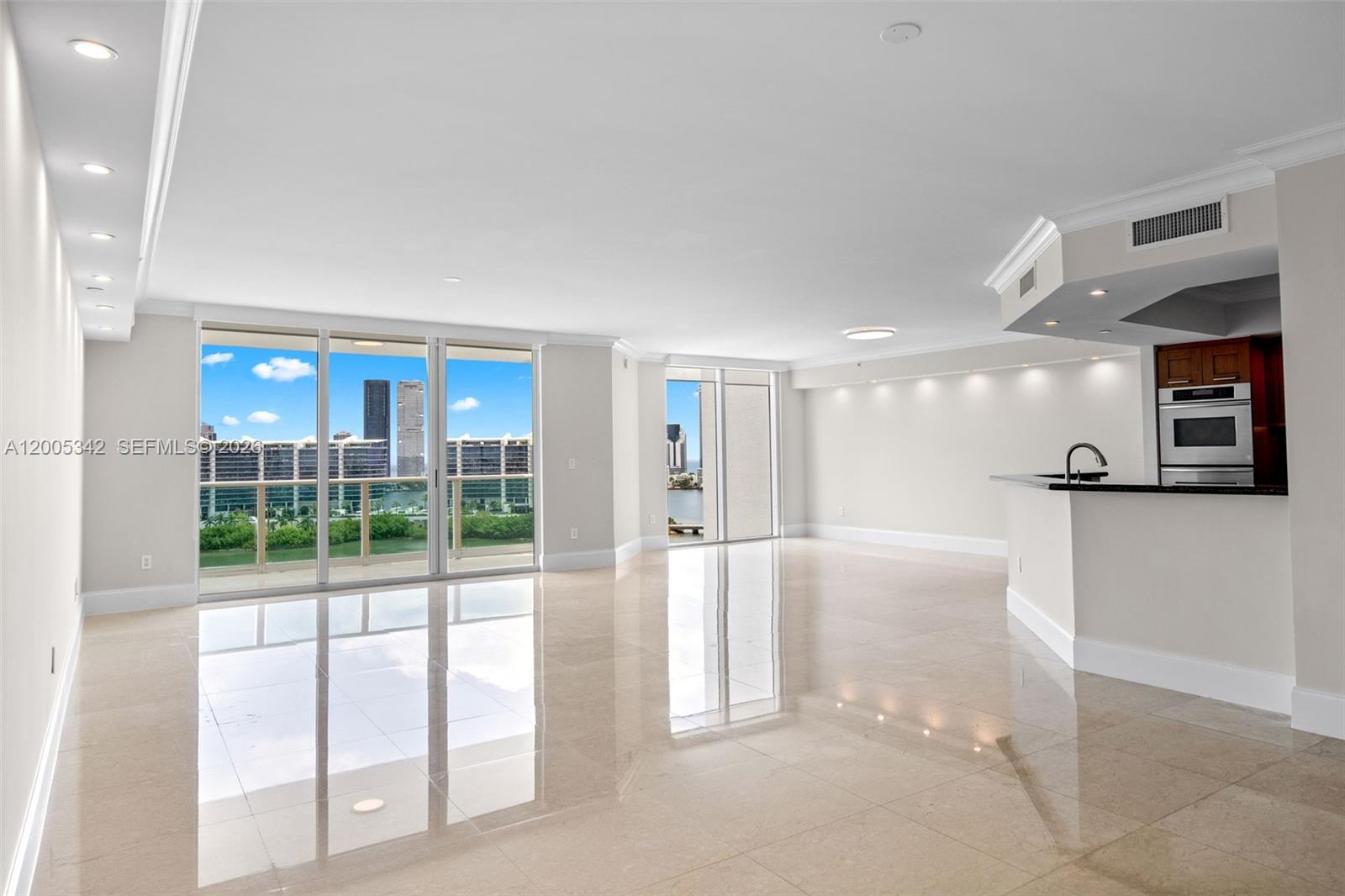 An open-concept living area features polished tile floors, recessed lighting, and floor-to-ceiling windows — 3301 NE 183rd St # 1604, Aventura FL 33160, AVENTURA, FL