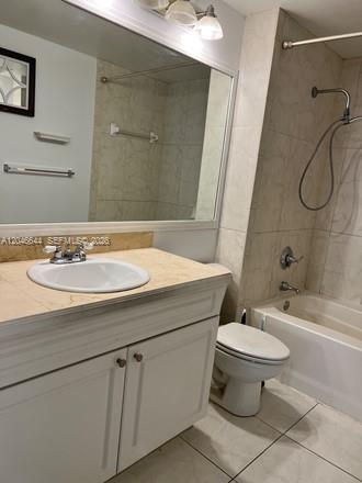 A bathroom features a white vanity with a sink, a mirror, and a shower-tub combination — 6841 SW 44th St # 204, Miami FL 33155, MIAMI, FL