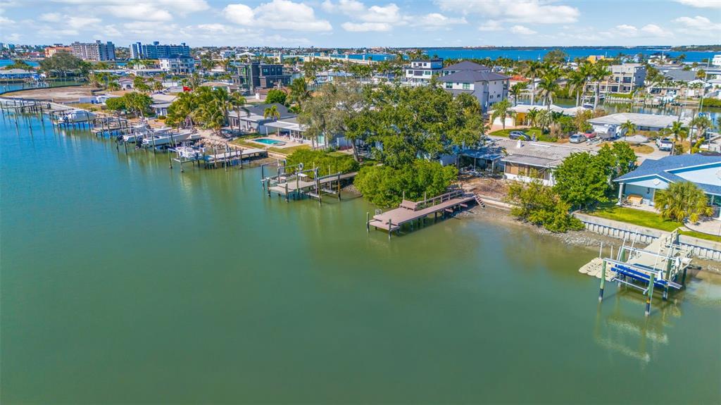 An aerial view of waterfront homes with private docks along a canal — 7932 2ND AVENUE S, ST PETERSBURG, FL