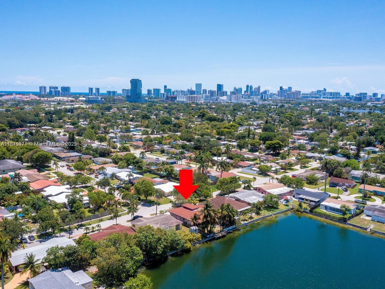 An aerial view shows a residential house with a red arrow pointing to its roof — 232 SW 7th Ave, Hallandale Beach FL 33009, HALLANDALE BEACH, FL