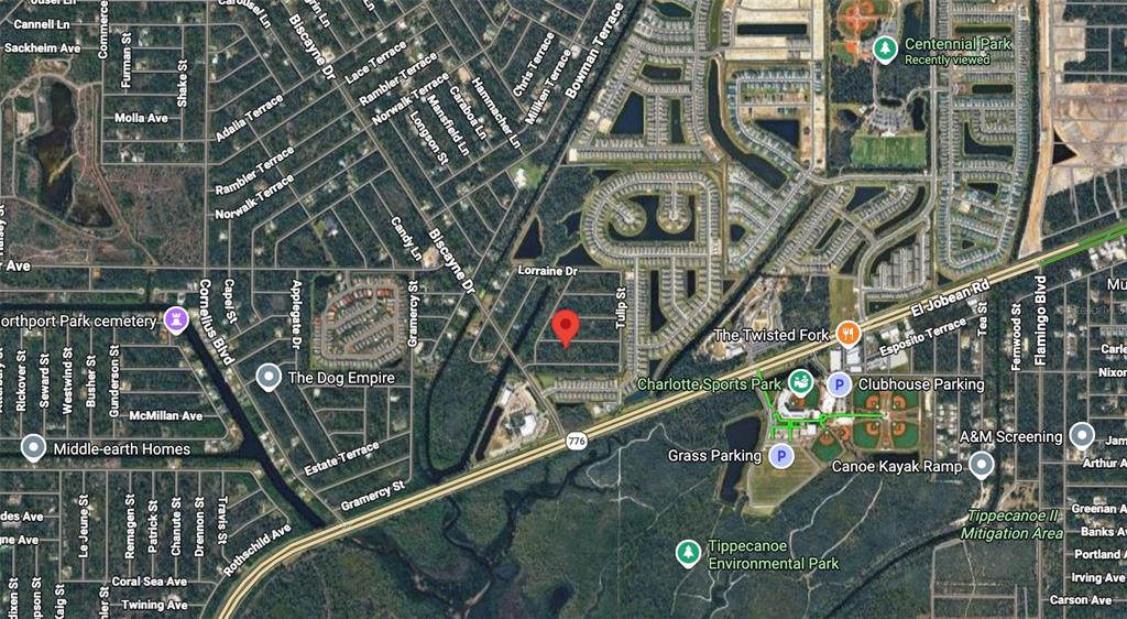 This is a satellite map view of a residential area near Charlotte Sports Park — 15469 OASIS AVENUE, PORT CHARLOTTE, FL