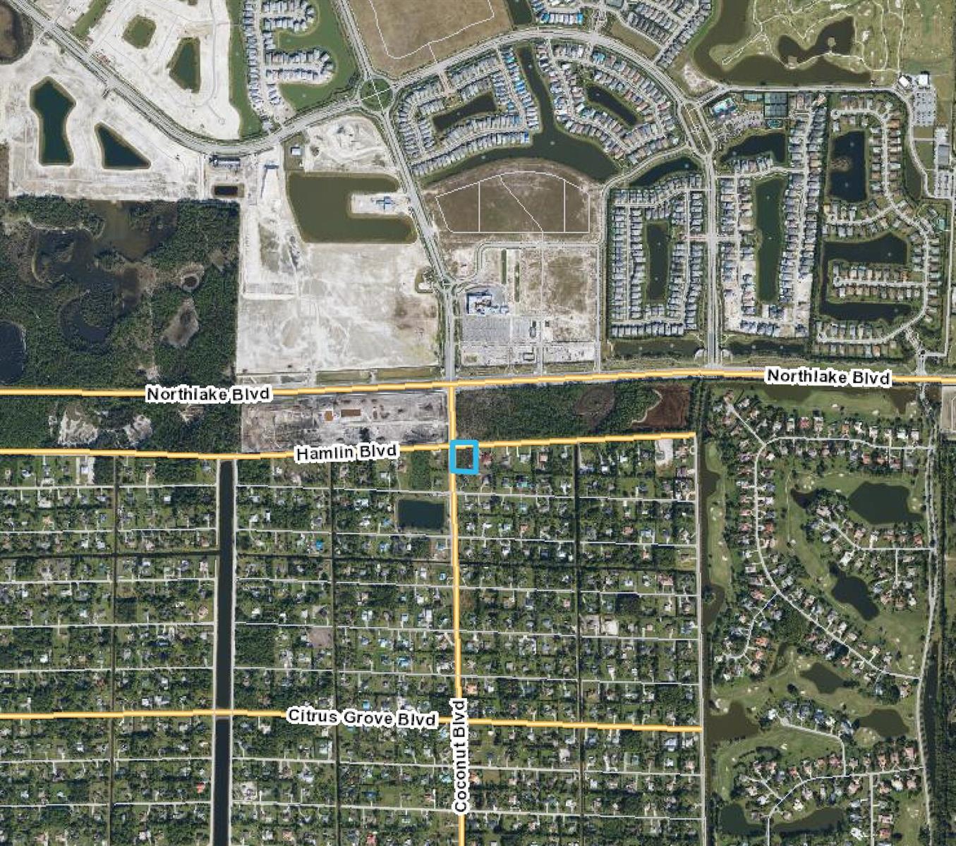 This is an aerial map showing a highlighted property lot near the intersection of two boulevards — 0000 Hamlin Blvd, FL 33412, FL
