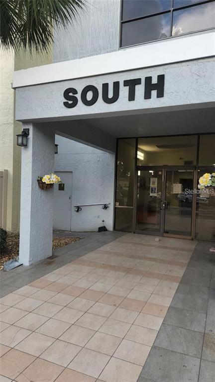 The exterior entrance of a building marked with the word South above glass doors — 701 S MADISON AVENUE UNIT 215, CLEARWATER, FL