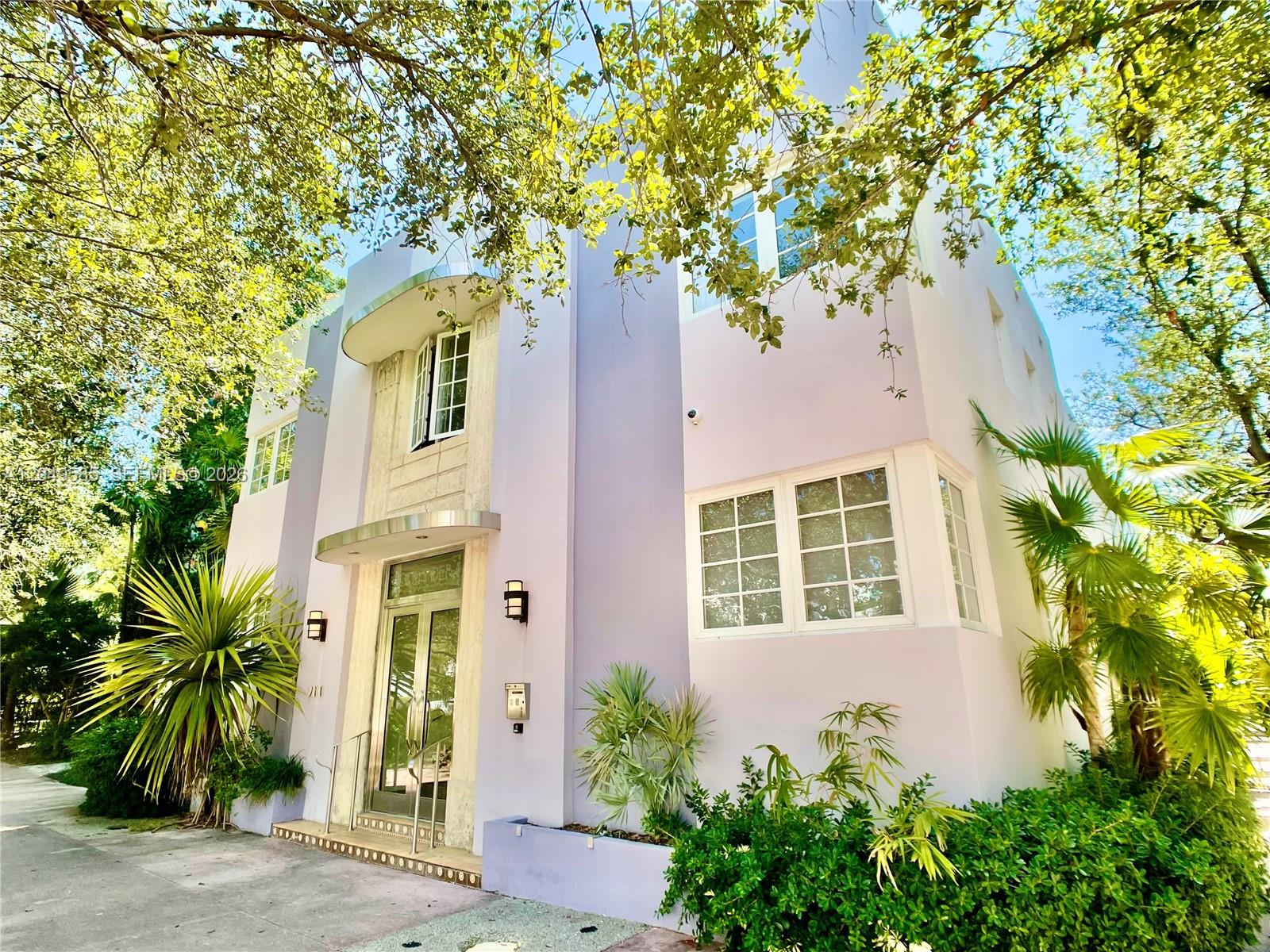 A two-story, light purple Art Deco building features a curved entrance canopy and lush landscaping — 260 Euclid Ave # 6, Miami Beach FL 33139, MIAMI BEACH, FL