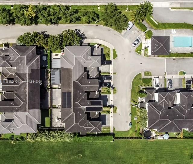 This aerial view shows a residential neighborhood with townhomes, a swimming pool, and landscaping — 22509 SW 102nd Ave, Miami FL 33190, MIAMI, FL
