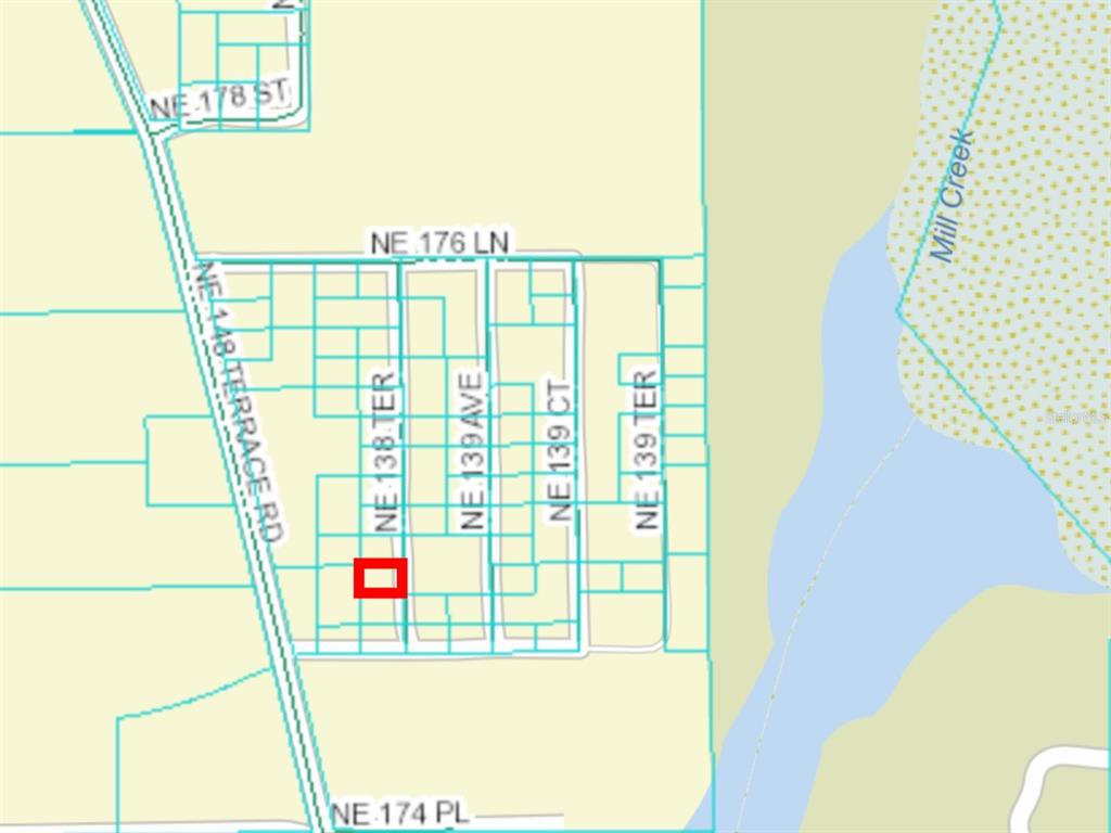 This is a map showing a highlighted property lot within a residential neighborhood — 0 NE 138TH TERRACE, FORT MC COY, FL
