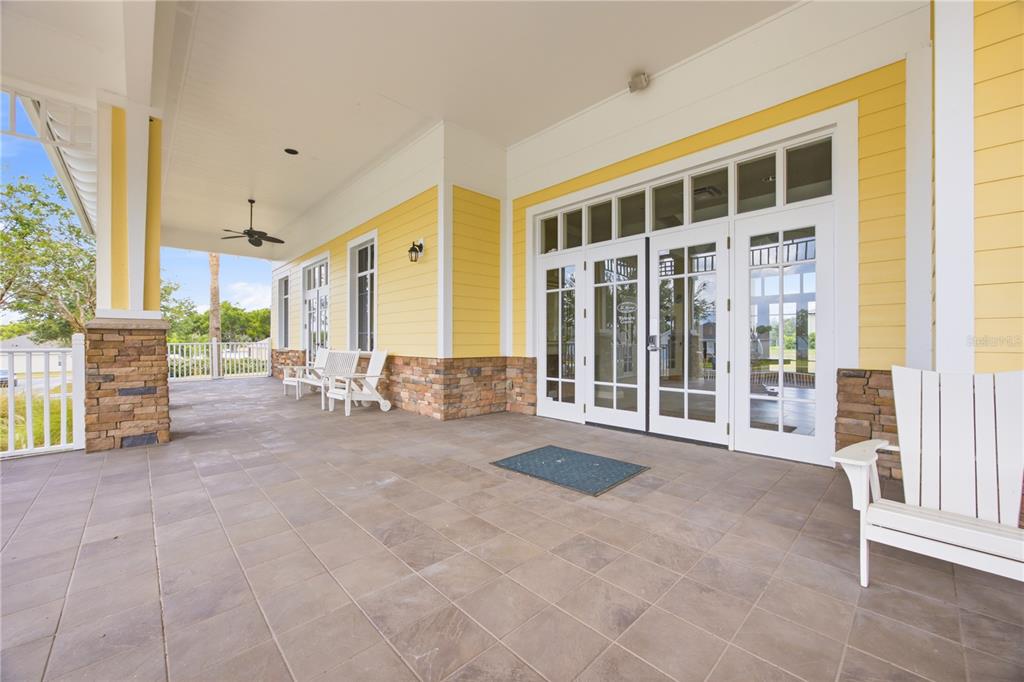A bedroom features a tufted headboard, a bench, a dresser, and a window — 6217 SANDERS GROVE CIRCLE, OKAHUMPKA, FL