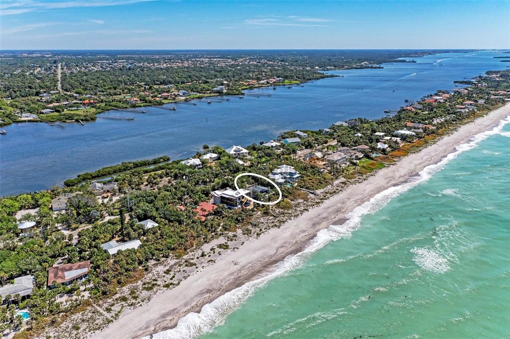 An aerial view shows a coastal property with a white circle highlighting a house — 8270 MANASOTA KEY ROAD, ENGLEWOOD, FL