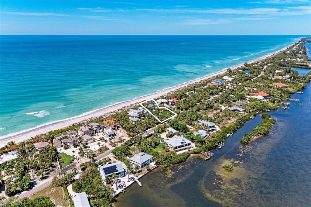 An aerial view shows a coastal property outlined in white between the ocean and bay — 8270 MANASOTA KEY ROAD, ENGLEWOOD, FL