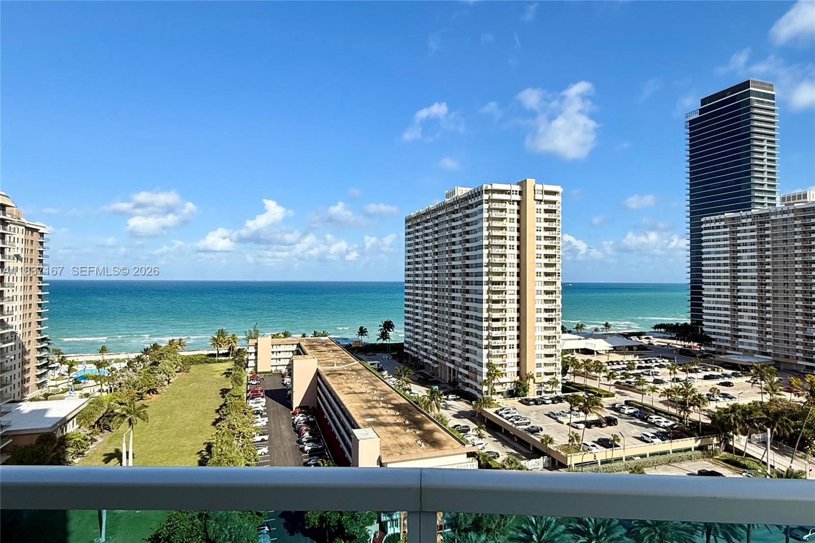 An elevated view shows a beach, ocean, and several high-rise apartment buildings — 1945 S Ocean Dr # 1201, Hallandale Beach FL 33009, HALLANDALE BEACH, FL