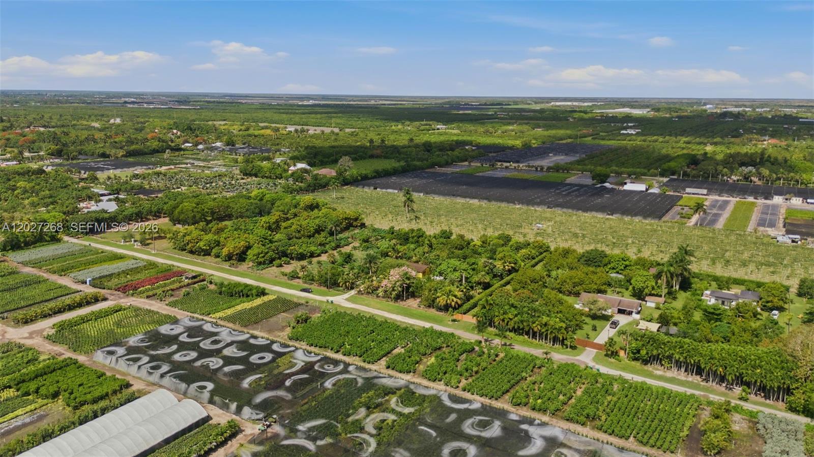 An aerial view shows a large agricultural property with greenhouses, crop fields, and a house — 25800 SW 199th Ave, Homestead FL 33031, HOMESTEAD, FL