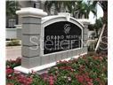 A stone monument sign for The Grand Reserve stands in front of a landscaped garden — 3367 S KIRKMAN ROAD UNIT 1111, ORLANDO, FL