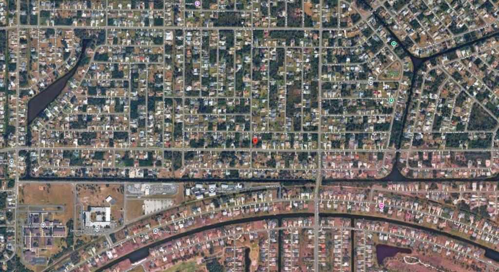 This is an aerial map view of a residential neighborhood with a red location marker — 10420 GULFSTREAM BOULEVARD, ENGLEWOOD, FL