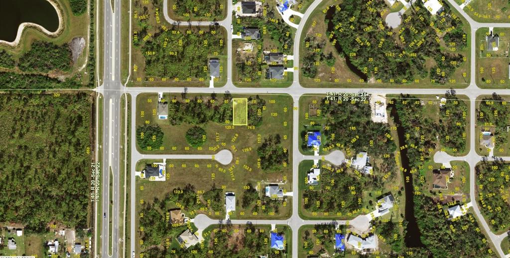 This is an aerial map showing a vacant residential lot highlighted in yellow — 123 SUNSET ROAD, ROTONDA WEST, FL