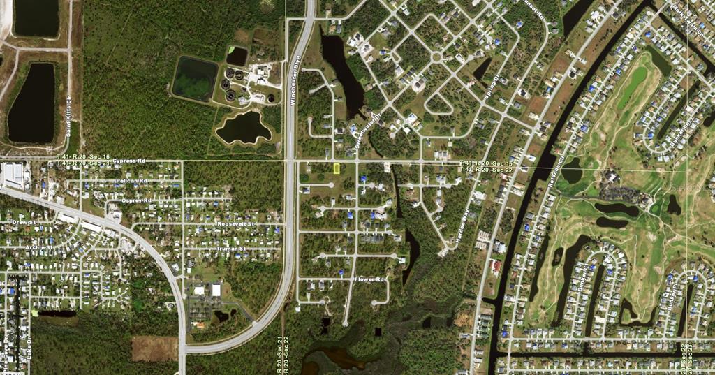 This is an aerial map showing a residential neighborhood with streets and undeveloped land — 123 SUNSET ROAD, ROTONDA WEST, FL