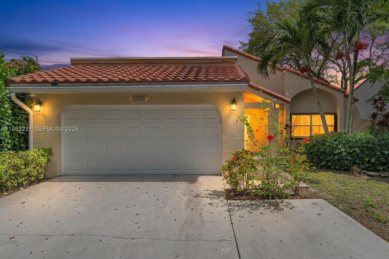 A single-story house with a terracotta tile roof, a garage, and a concrete driveway — 2905 Begonia Way, Cooper City FL 33026, COOPER CITY, FL