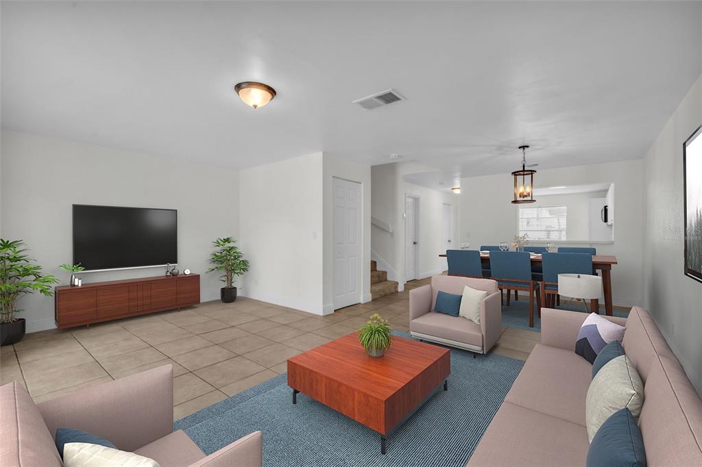 A yellow two-story townhouse exterior with a brown front door and a large green tree — 1610 NW 93RD AVENUE UNIT 303, HOLLYWOOD, FL
