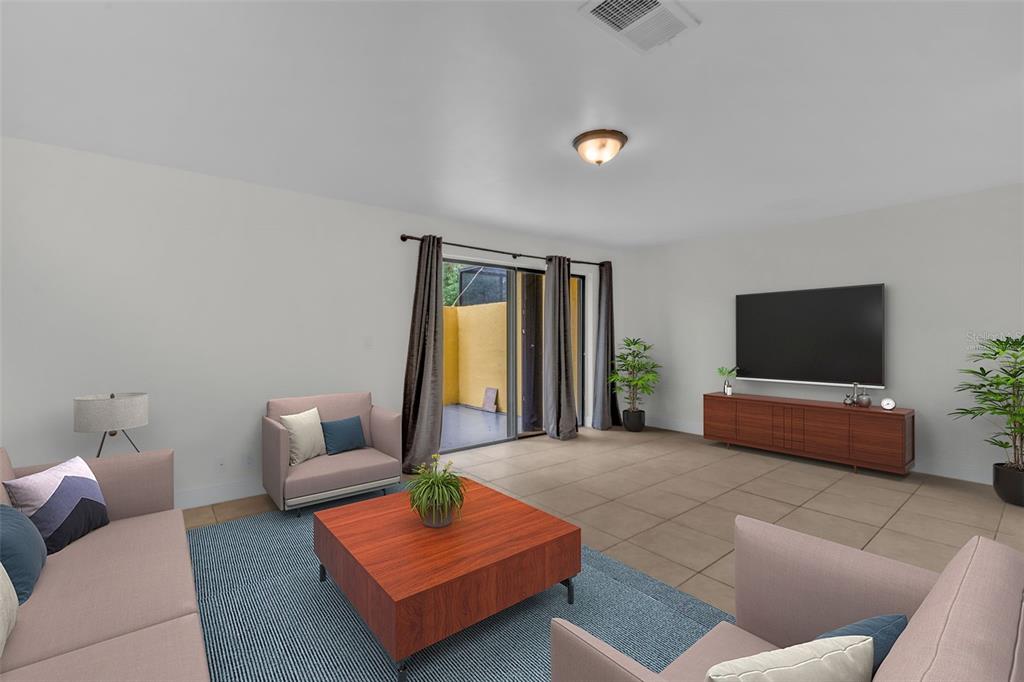 A kitchen features white shaker cabinets, granite countertops, and a stainless steel dishwasher — 1610 NW 93RD AVENUE UNIT 303, HOLLYWOOD, FL