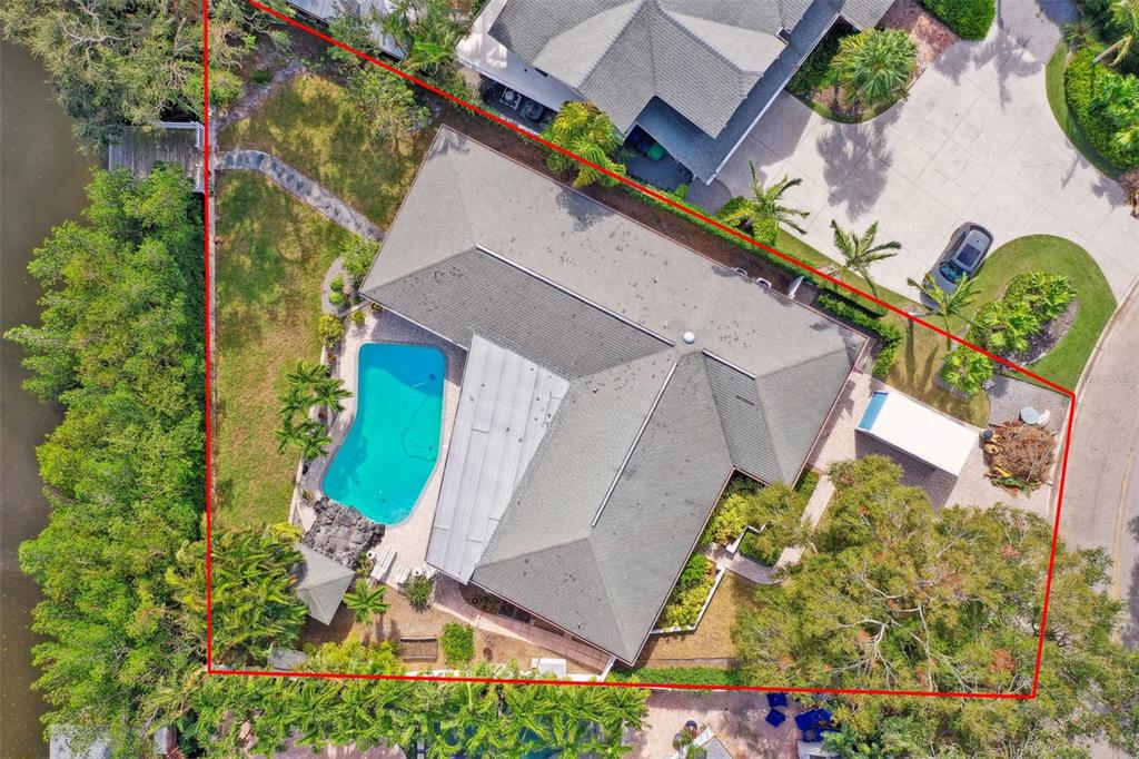 An aerial view shows a house with a pool, patio, and landscaping within a property boundary — 5104 W SAN JOSE STREET, TAMPA, FL