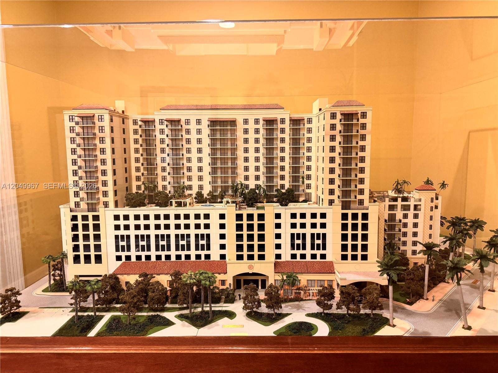 This is an architectural scale model of a large, multi-story residential building complex — 888 S Douglas Rd # 810, Coral Gables FL 33134, CORAL GABLES, FL