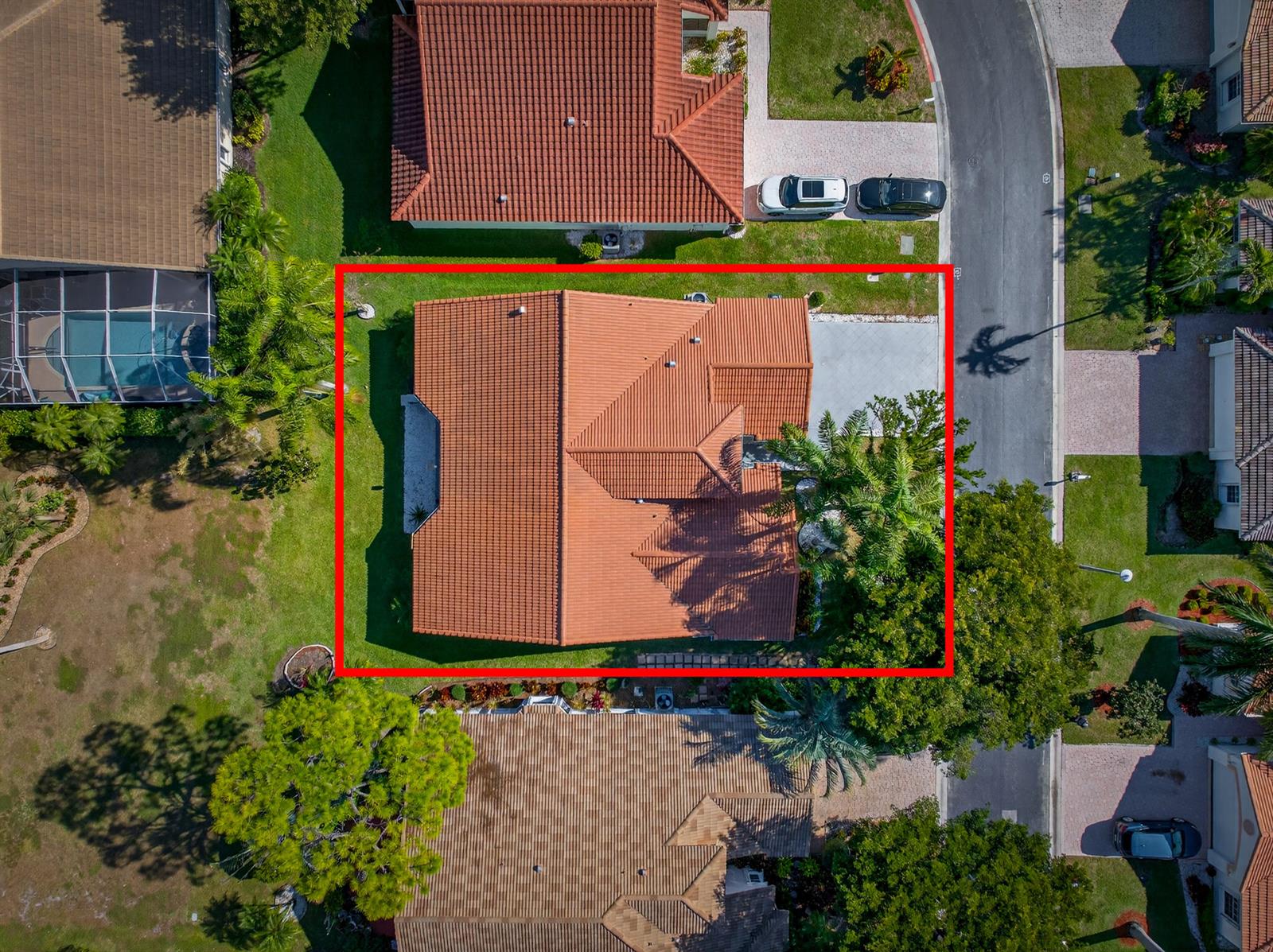 An aerial view shows a house with a terracotta tile roof inside a red border — 113 Egret Circle, FL 33413, FL