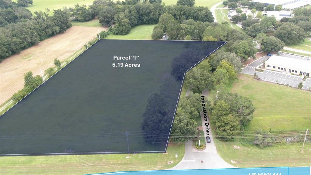 This aerial view shows a highlighted 5.19-acre parcel of land next to Innovation Drive — US 441 HIGHWAY, ALACHUA, FL
