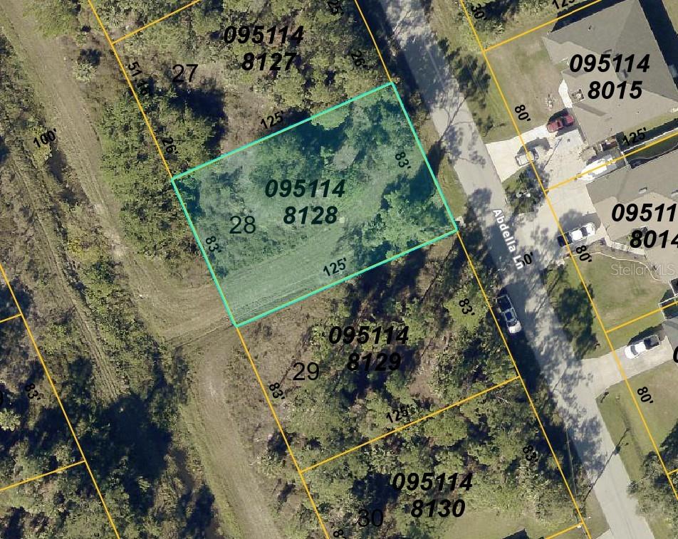 This is an aerial map showing a vacant rectangular lot highlighted in light blue — ABDELLA LANE, NORTH PORT, FL