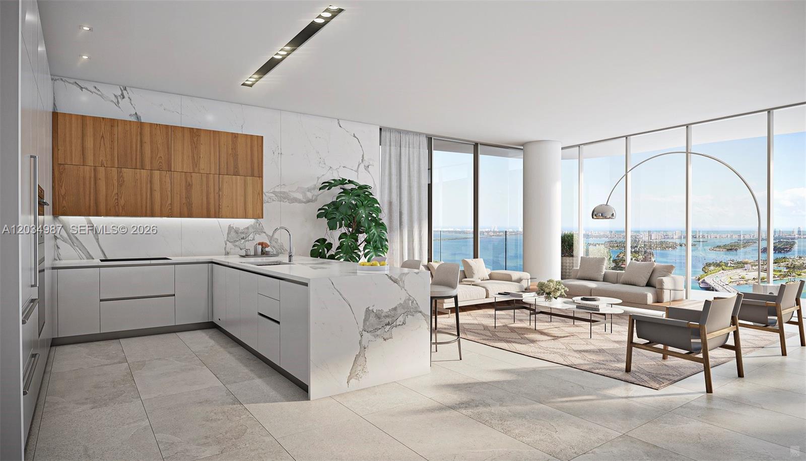 This rendering shows a modern open-concept kitchen and living area with marble finishes and water views — 1400 Biscayne Boulevard # 4001, Miami FL 33132, MIAMI, FL
