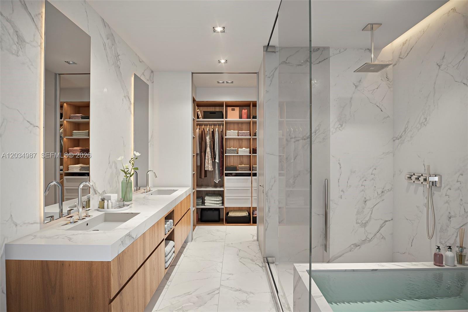 This rendering shows a modern bathroom with marble walls, a double vanity, and a walk-in closet — 1400 Biscayne Boulevard # 4001, Miami FL 33132, MIAMI, FL