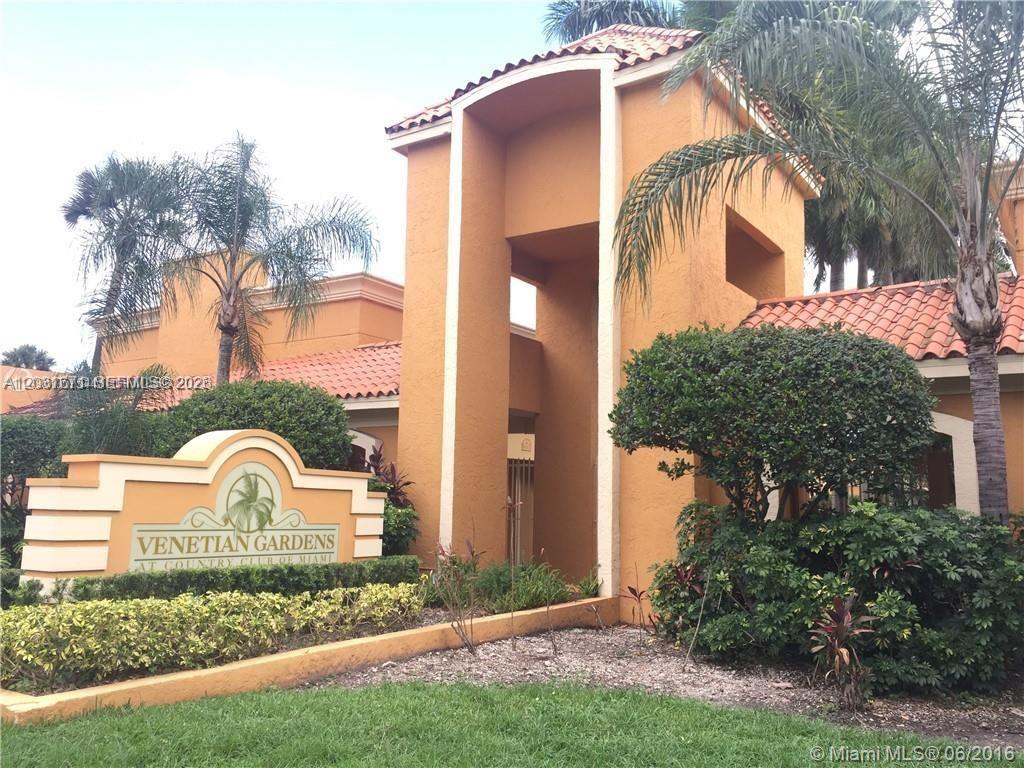The exterior of the Venetian Gardens at Country Club of Miami features a stucco entrance — 18111 NW 68th Ave # H102, Hialeah FL 33015, HIALEAH, FL