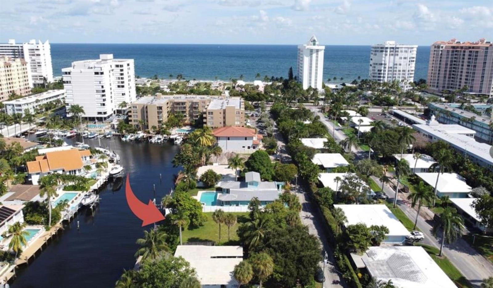An aerial view of a waterfront property with a swimming pool and a boat dock — 5 Sunset Lane, Pompano Beach FL 33062, POMPANO BEACH, FL