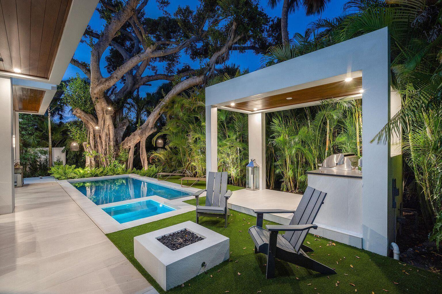 A backyard patio features a swimming pool, fire pit, lounge chairs, and a covered outdoor kitchen — 775 W Park Dr Drive W, Boca Raton FL 33432, BOCA RATON, FL