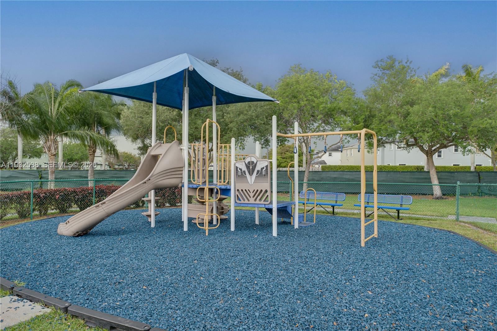 A two-story house with a terracotta tile roof and a paved driveway — 3134 NE 3rd Dr, Homestead FL 33033, HOMESTEAD, FL
