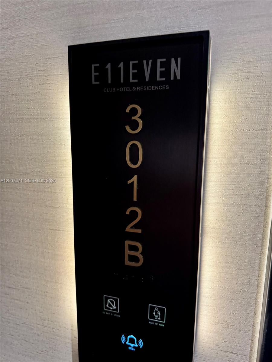 A vertical black sign for room 3012B at E11EVEN Club Hotel & Residences — 20 NE 11th St # 3012B, Miami FL 33132, MIAMI, FL
