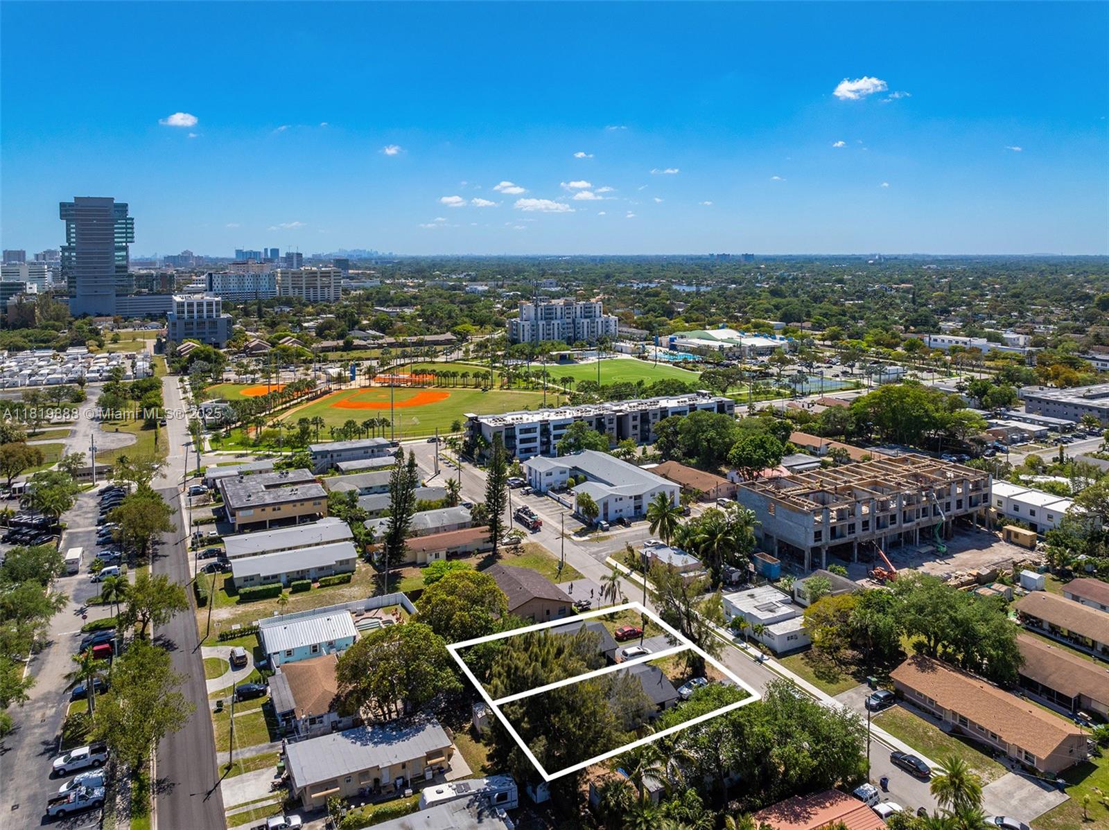 An aerial view shows a residential neighborhood with a highlighted property lot and nearby park — 311 SE 3rd Ave, Hallandale Beach FL 33009, HALLANDALE BEACH, FL