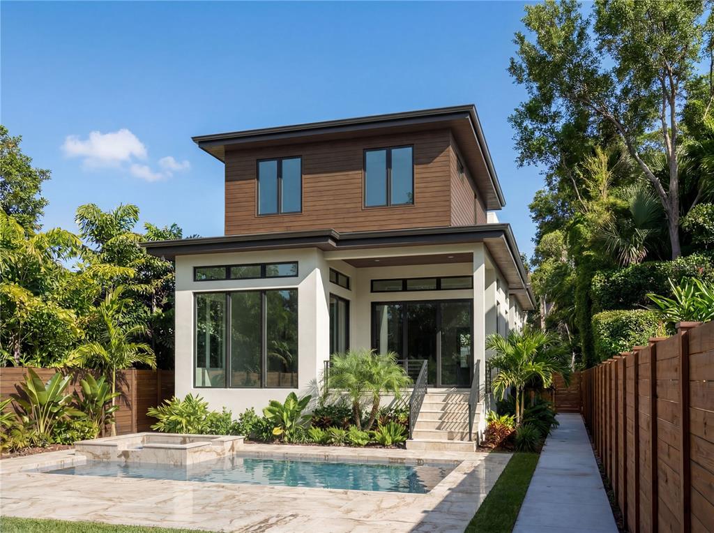 A two-story modern house with a swimming pool and a wooden fence in the backyard — 4183 ROBERTS POINT CIRCLE LOT 18, SARASOTA, FL