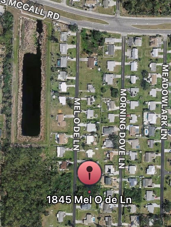 This is an aerial map view of a residential neighborhood with a marked property location — 1845 MEL O DE LANE, ENGLEWOOD, FL