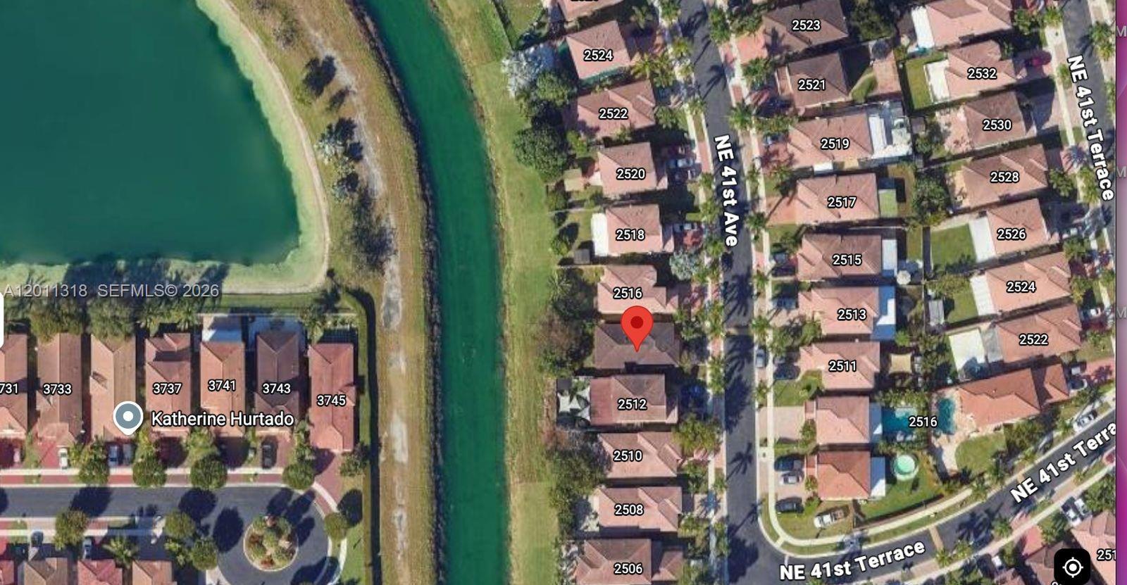 This is an aerial map view showing a residential neighborhood with houses and a canal — 2514 NE 41st Ave, Homestead FL 33033, HOMESTEAD, FL