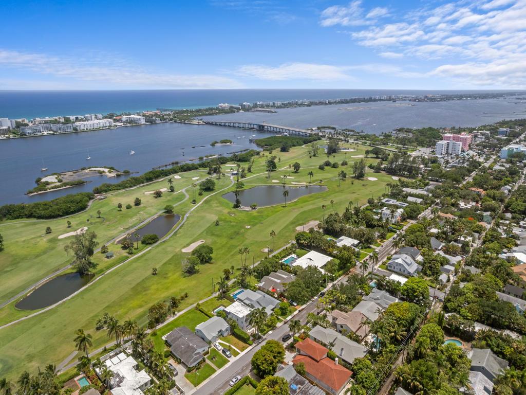 An aerial view shows a golf course adjacent to a residential neighborhood and a coastal waterway — 422 N Lakeside Drive, FL 33460, FL