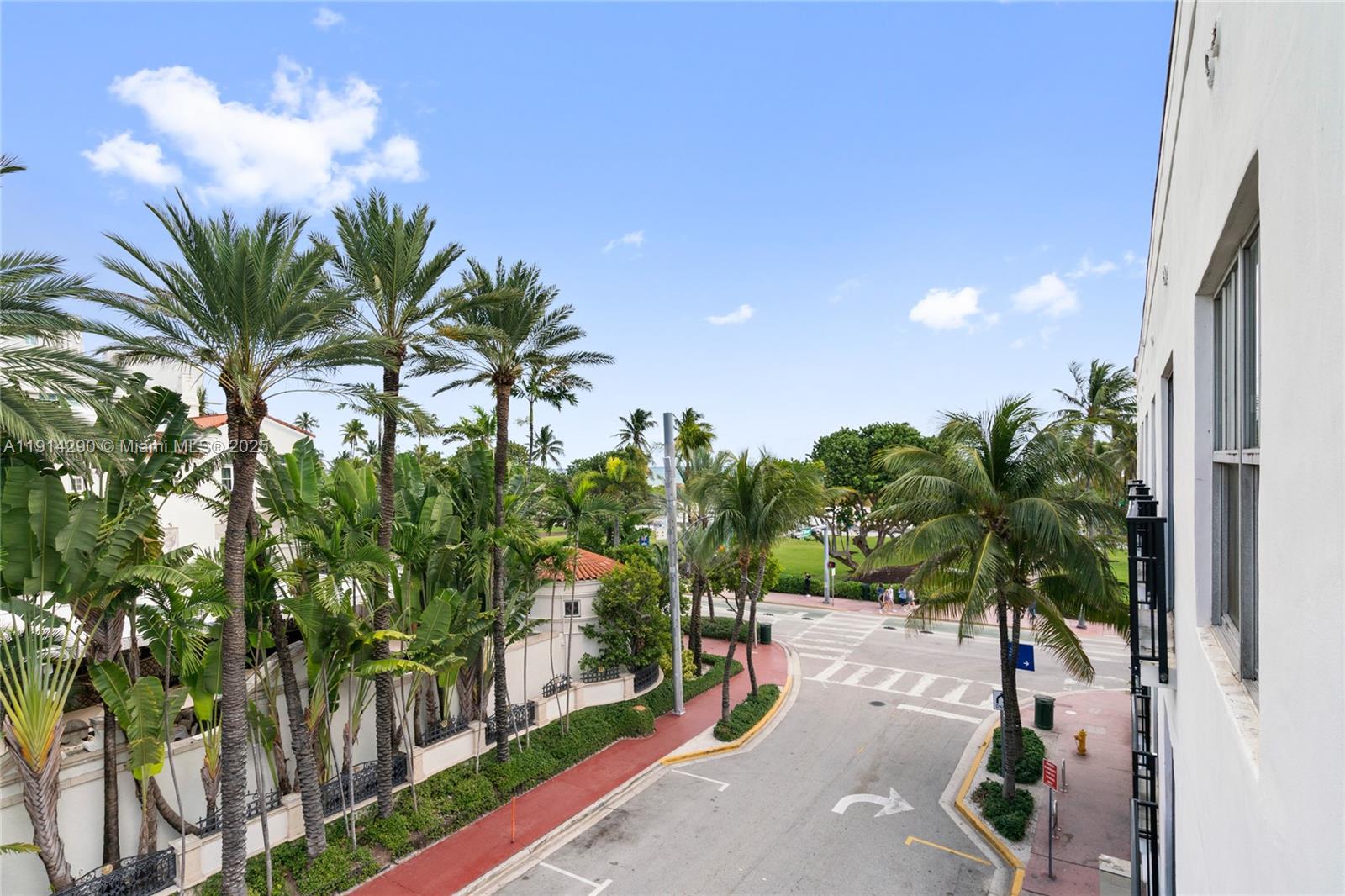 An elevated view shows a street intersection lined with palm trees and tropical landscaping — 1060 Ocean Dr # D307, Miami Beach FL 33139, MIAMI BEACH, FL