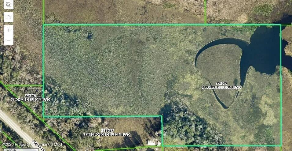 This aerial map shows a large, undeveloped parcel of land with a prominent water feature — 0 PONCE DE LEON BOULEVARD, BROOKSVILLE, FL
