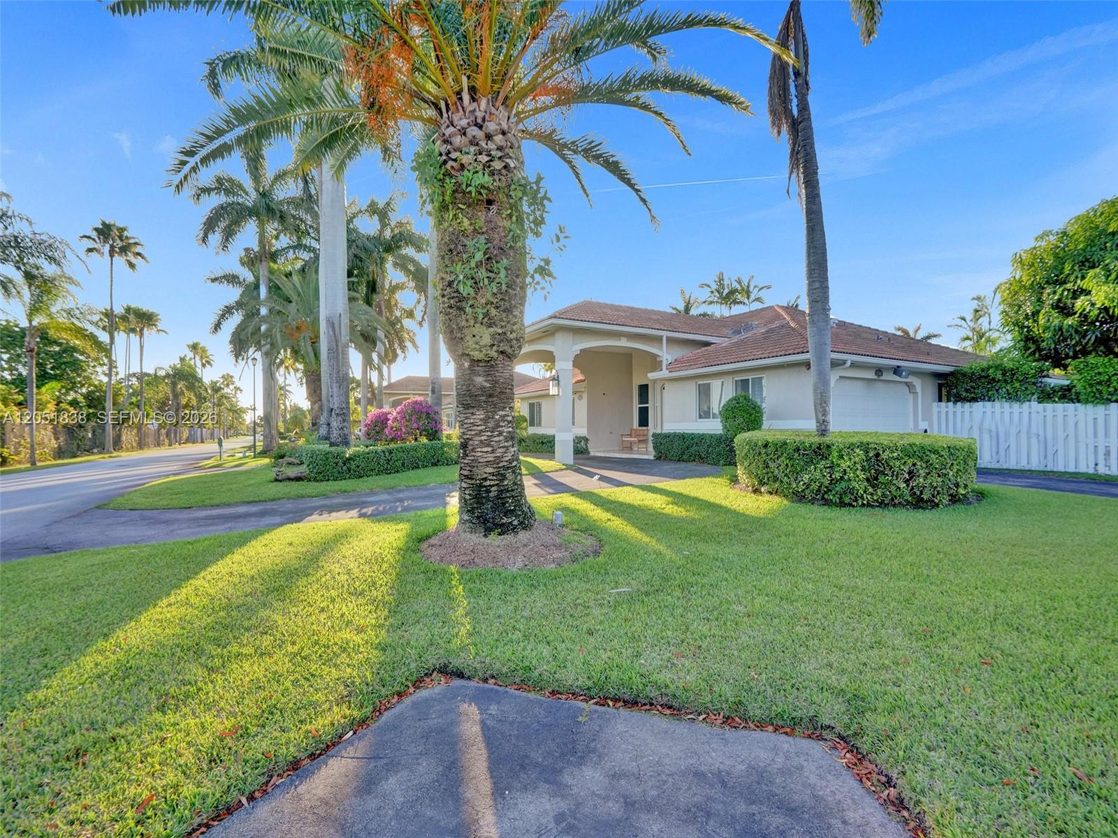 A single-story house with a palm tree in the front yard and a paved driveway — 12401 SW 77th St # 12401, Miami FL 33183, MIAMI, FL