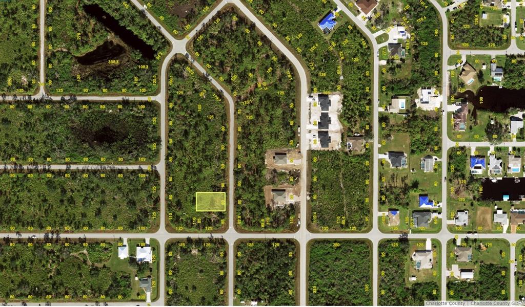 This is an aerial map showing a vacant lot highlighted in yellow within a residential neighborhood — 3359 EL SALVADOR ROAD, PORT CHARLOTTE, FL