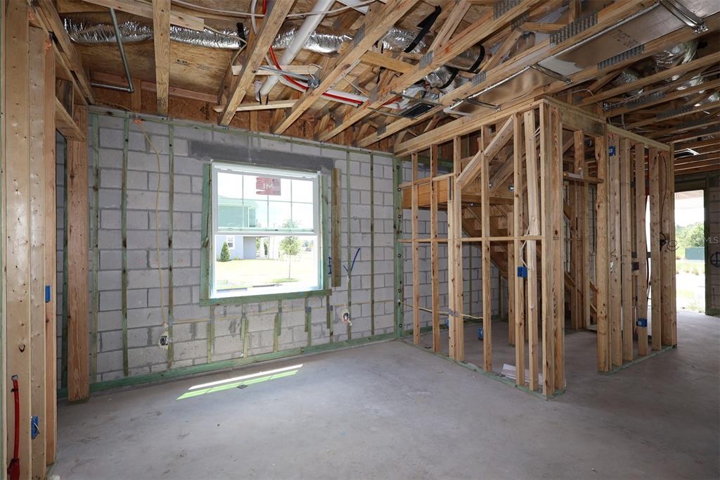 An interior view of a room under construction with concrete block walls and exposed framing — 5294 CENTER LAKE RANCH BOULEVARD, ST CLOUD, FL